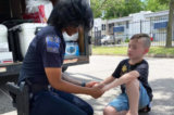 7-Year-Old Boy Prays With Local Police Officers Amid Protests, His ‘Mission’ Goes Viral